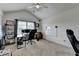 Bright home office featuring a vaulted ceiling, carpet flooring, and a large window at 4590 Sierra Creek Dr, Hoschton, GA 30548