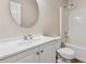 Bright bathroom with a white vanity, toilet, and shower-tub combination at 4958 Alpine Ct, Winston, GA 30187