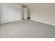 Bedroom featuring carpet, closet, and a doorway leading to another room at 4958 Alpine Ct, Winston, GA 30187