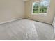 Neutral bedroom with carpet, a large window with outdoor views at 4958 Alpine Ct, Winston, GA 30187
