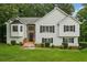 Charming two-story home boasts manicured lawn, white siding, black shutters, and inviting entrance at 4958 Alpine Ct, Winston, GA 30187