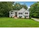 Beautiful two-story home featuring a well-maintained lawn and classic white siding at 4958 Alpine Ct, Winston, GA 30187