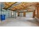 Spacious garage featuring multiple doors and ample room for vehicles and storage at 4958 Alpine Ct, Winston, GA 30187