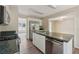 Modern kitchen with stainless steel appliances, laminate flooring, and plenty of counter space at 4958 Alpine Ct, Winston, GA 30187