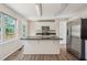 Bright kitchen with stainless steel appliances, center island, and ample counter space at 4958 Alpine Ct, Winston, GA 30187