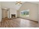 Bright living room features vaulted ceilings, a stone fireplace, and beautiful wood floors at 4958 Alpine Ct, Winston, GA 30187