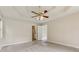 Main bedroom features carpet, a ceiling fan, an ensuite bathroom and multiple windows at 4958 Alpine Ct, Winston, GA 30187