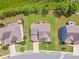 Aerial view of a home showcasing a manicured lawn, deck, and inviting backyard in a residential neighborhood at 506 Spring View Dr, Woodstock, GA 30188