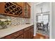 Butler's pantry with custom cabinetry, countertop space, and a view to the dining room at 506 Spring View Dr, Woodstock, GA 30188