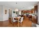Charming dining area adjacent to kitchen with views of the backyard at 506 Spring View Dr, Woodstock, GA 30188