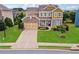 Beautiful two-story home featuring a well-manicured lawn, inviting curb appeal, and a spacious driveway at 506 Spring View Dr, Woodstock, GA 30188