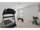 Gym with modern treadmill, step platform, and weights, perfect for staying fit and active at home at 506 Spring View Dr, Woodstock, GA 30188