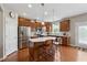 Modern kitchen with stainless steel appliances and center island with seating at 506 Spring View Dr, Woodstock, GA 30188