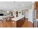 Open concept kitchen, dining, and living area with hardwood floors at 506 Spring View Dr, Woodstock, GA 30188