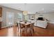 Open concept living area with dining, open access to the living room with lots of natural light at 506 Spring View Dr, Woodstock, GA 30188