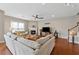 Bright living room featuring hardwood floors, fireplace, and staircase at 506 Spring View Dr, Woodstock, GA 30188
