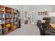 Cozy home office with a bookshelf and chair with bright light at 506 Spring View Dr, Woodstock, GA 30188