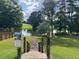 Scenic view of Woodview pond, with sign marked for residents only, perfect for picnics and relaxation at 506 Spring View Dr, Woodstock, GA 30188