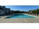 A refreshing swimming pool with lounge chairs on a sunny day, perfect for relaxation and recreation at 506 Spring View Dr, Woodstock, GA 30188