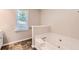 Bathroom showing a window and a bathtub at 11473 Summer Creek Dr, Hampton, GA 30228