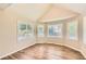 Bright bedroom featuring three windows with view of trees and vinyl flooring at 11473 Summer Creek Dr, Hampton, GA 30228