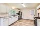 Bright kitchen features white cabinetry, granite countertops, and stainless steel appliances at 11473 Summer Creek Dr, Hampton, GA 30228