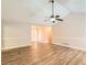 Bright living room featuring wood floors, neutral paint colors, and a ceiling fan at 11473 Summer Creek Dr, Hampton, GA 30228