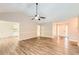 Bright living room featuring wood floors, neutral paint colors, and a ceiling fan at 11473 Summer Creek Dr, Hampton, GA 30228