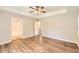 Spacious main bedroom has tray ceiling, vinyl flooring, and entry to bathroom at 11473 Summer Creek Dr, Hampton, GA 30228