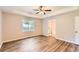 This is a primary suite with tray ceiling, vinyl flooring and door to ensuite at 11473 Summer Creek Dr, Hampton, GA 30228