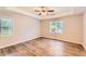 The primary suite features a tray ceiling and vinyl flooring at 11473 Summer Creek Dr, Hampton, GA 30228