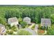 Aerial view of three homes on a cul-de-sac, showcasing the neighborhood layout and landscaping at 1223 Gathering Oaks Se Ct, Mableton, GA 30126