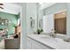 This bathroom features a white sink and vanity with a mirror above at 1223 Gathering Oaks Se Ct, Mableton, GA 30126