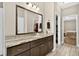 Modern bathroom featuring double vanity with granite counters, large mirror, and tile floors at 1223 Gathering Oaks Se Ct, Mableton, GA 30126