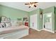 Light-filled bedroom with pull out bed, neutral carpet, and attached bath at 1223 Gathering Oaks Se Ct, Mableton, GA 30126
