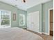 This bedroom features a closet, neutral carpet, and two windows with natural light at 1223 Gathering Oaks Se Ct, Mableton, GA 30126