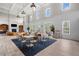 Spacious community area with coffered ceilings, fireplace, ample seating, and large windows at 1223 Gathering Oaks Se Ct, Mableton, GA 30126