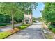 Well-maintained community entrance with manicured landscaping at 1223 Gathering Oaks Se Ct, Mableton, GA 30126