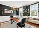 Stylish dining room with modern chandelier, dark accent wall, and ample natural light at 1223 Gathering Oaks Se Ct, Mableton, GA 30126