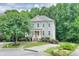 Charming two-story home with manicured lawn, beautiful landscaping, and a paved driveway at 1223 Gathering Oaks Se Ct, Mableton, GA 30126