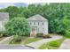 Charming two-story home with a landscaped yard and a welcoming front entrance at 1223 Gathering Oaks Se Ct, Mableton, GA 30126