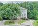 Beautiful two-story home with lush landscaping, a walkway, and a driveway at 1223 Gathering Oaks Se Ct, Mableton, GA 30126