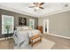 Spacious main bedroom with tray ceiling, two windows, ceiling fan, and ensuite access at 1223 Gathering Oaks Se Ct, Mableton, GA 30126
