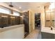 Modern bathroom featuring a walk-in shower, tile accents and a walk-in closet at 330 Carriage Glen Ln, Woodstock, GA 30188