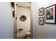 Stylish half bathroom with contemporary fixtures, artwork, and clean design at 330 Carriage Glen Ln, Woodstock, GA 30188