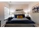 Serene bedroom featuring stylish lamps, comfortable bed, and calming artwork at 330 Carriage Glen Ln, Woodstock, GA 30188