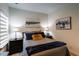 Cozy bedroom featuring a comfortable bed, stylish lamps, and tasteful artwork at 330 Carriage Glen Ln, Woodstock, GA 30188