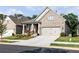 Charming two-story home with a well-manicured lawn and a welcoming front porch, exuding curb appeal at 330 Carriage Glen Ln, Woodstock, GA 30188