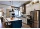 Modern kitchen with a large island, stainless steel appliances, and ample cabinet space at 330 Carriage Glen Ln, Woodstock, GA 30188
