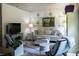 Cozy living room featuring a comfortable sofa, stylish rug, and elegant decor, creating a warm atmosphere at 330 Carriage Glen Ln, Woodstock, GA 30188